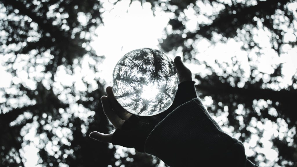 Close-Up Photo of Person Holding Lensball
